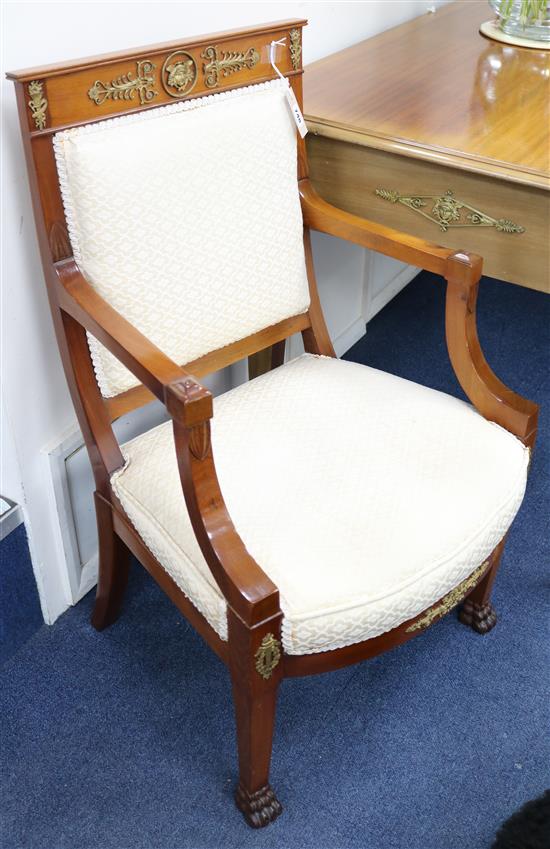 A French Empire style cherry wood fauteuil, with ormolu mounts